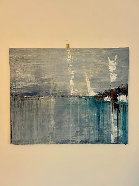 Abstract artwork featuring shades of grey and blue with soft, textured lines.