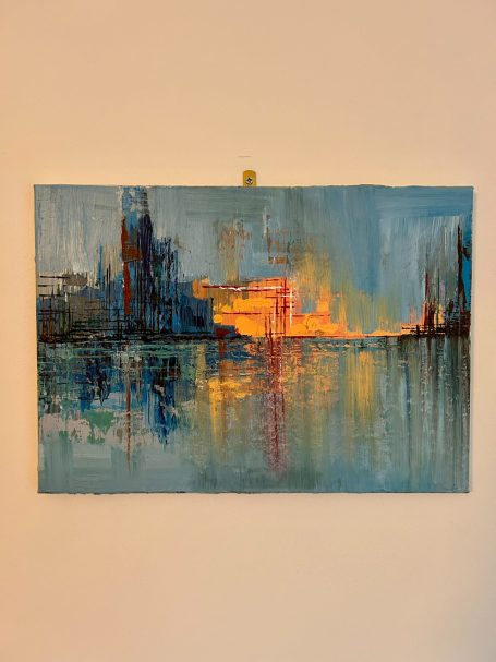 Abstract landscape painting featuring vibrant oranges and blues reflecting in water.